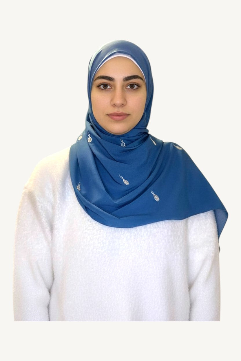 Blue hijab with repeated tulip embroidery in lightweight polyester fabric