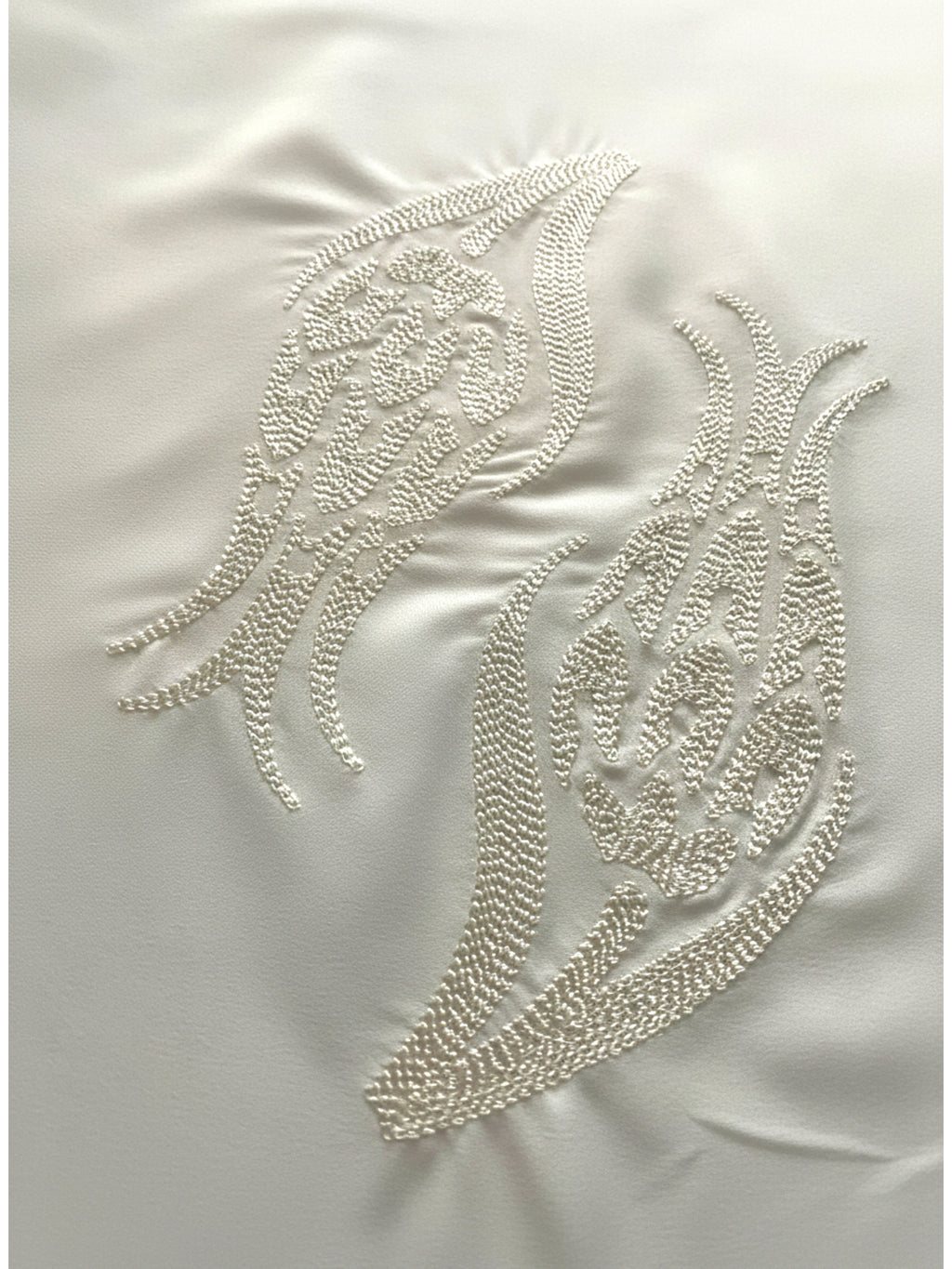 White hijab with iznik tulip embroidery in lightweight polyester fabric