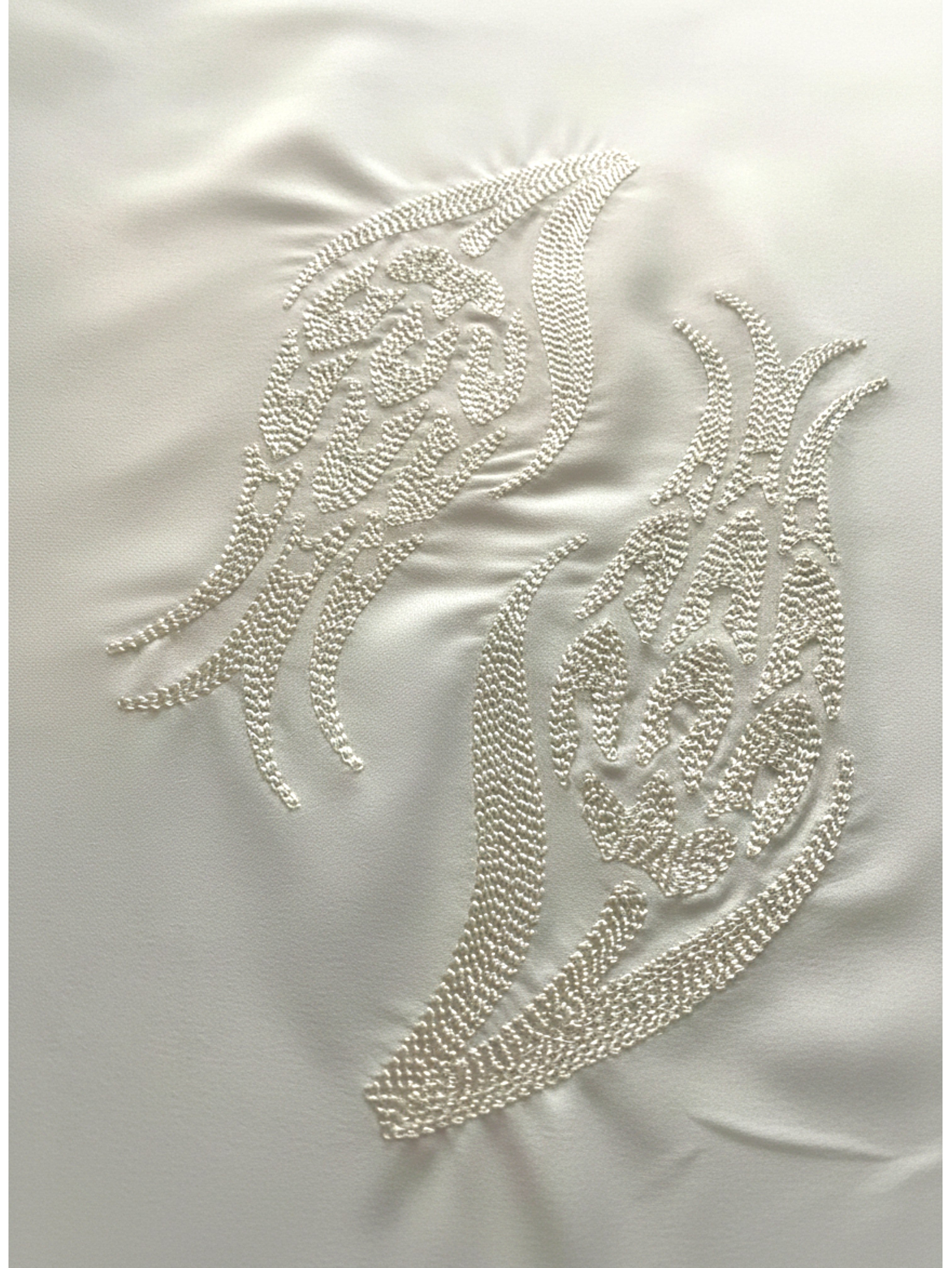 White hijab with iznik tulip embroidery in lightweight polyester fabric